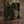Brodequin's 'Methods of Execution' digipak shown at an angle on a textured brown surface. The cover features dark, gritty artwork with a metallic-looking title in ornate gold lettering reading 'Brodequin' and smaller gold text 'Methods of Execution.