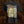 A black short-sleeve graphic t-shirt featuring the metal band Brodequin and their 'Perpetuation of Suffering' album artwork, displayed against a dark, textured brown background.
